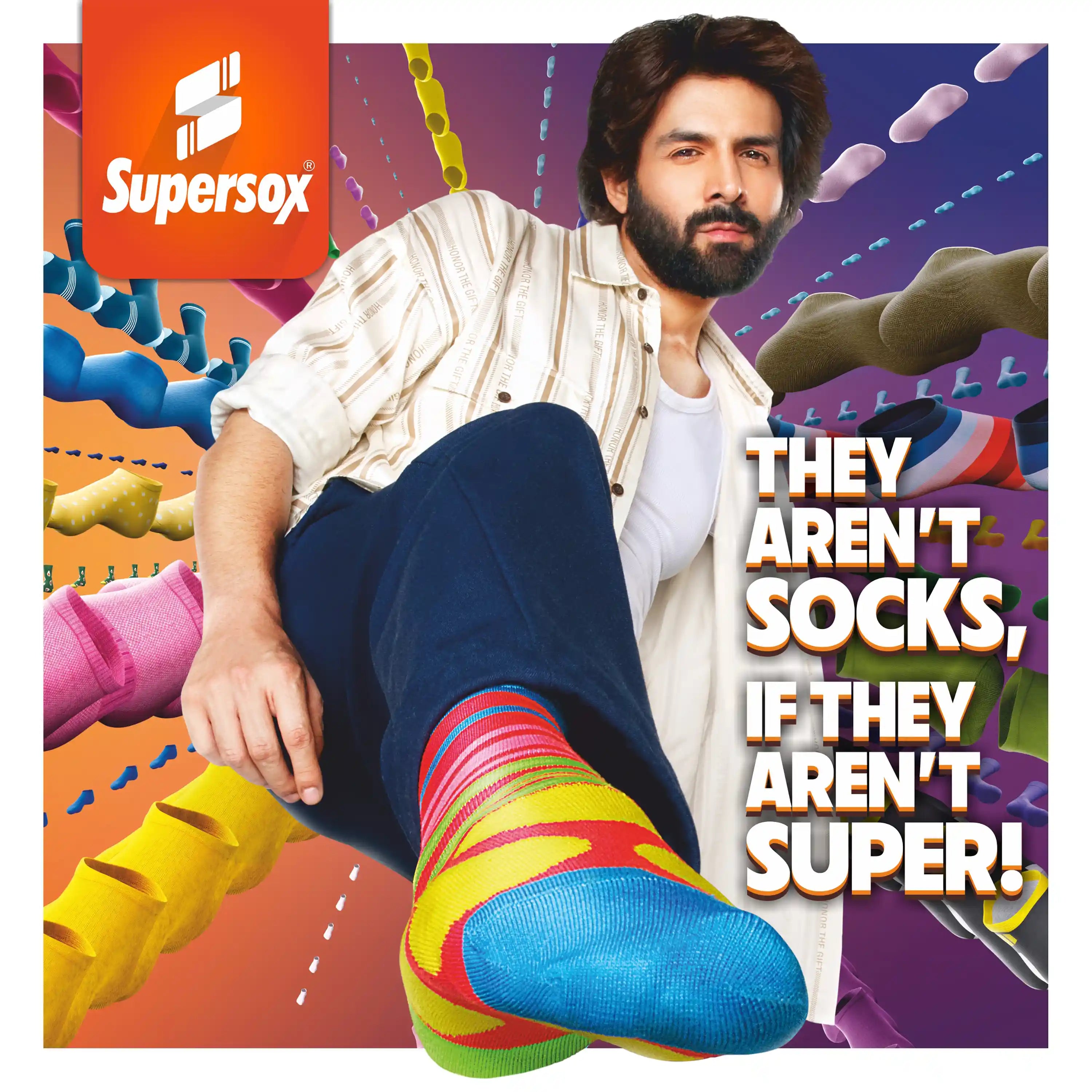 Kartik Aryan wearing colorful socks with a Supersox logo